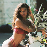 Girl on Moped wearing cherry red double strap bikini bottoms