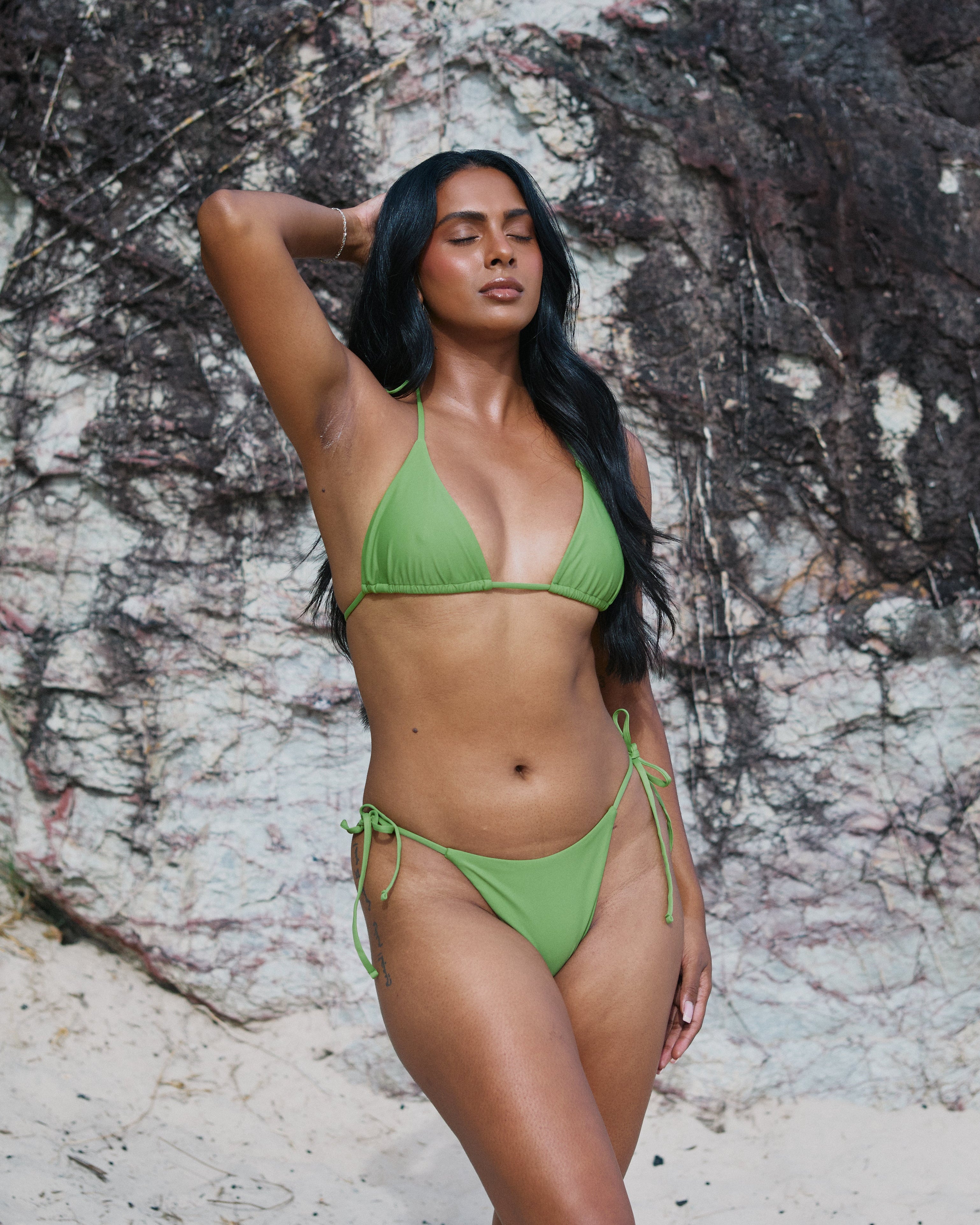 Sophie, Triangle Bikini Top -  Matcha on a model at the beach with a natural background, showcasing adjustable straps and stylish design.
