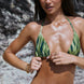 Sophie, Triangle Bikini Top -  Aurora worn by a model on the beach, showcasing its adjustable design and vibrant colors.