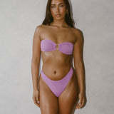 Isa Bikini Bottoms - Blush on model showcasing elegant style and high leg cut for flattering look.